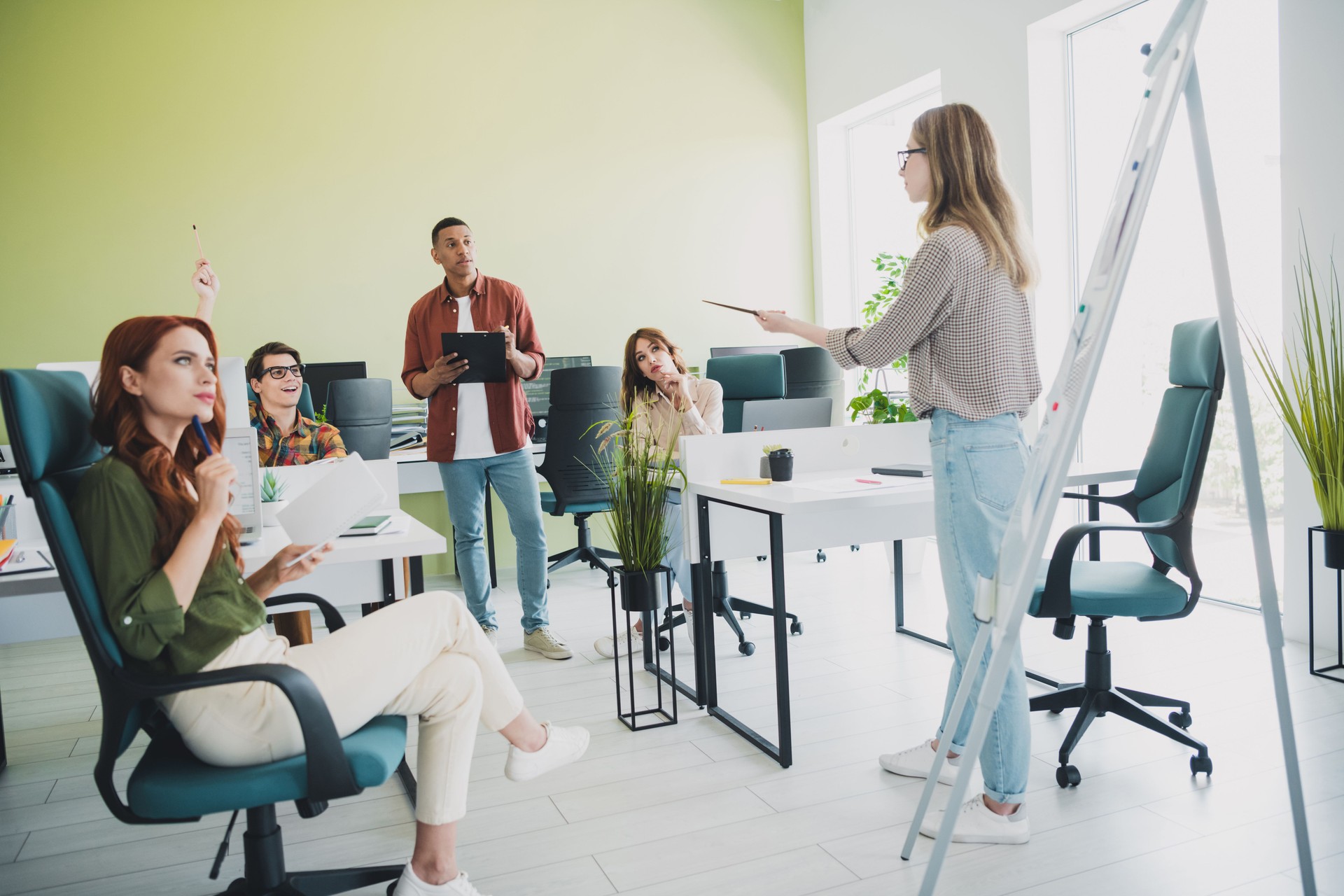 Photo of smart cheerful young it coworkers enjoying professional education together listening lecture indoors workplace workshop